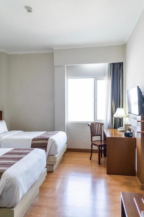 Chambre avec deux lits simples